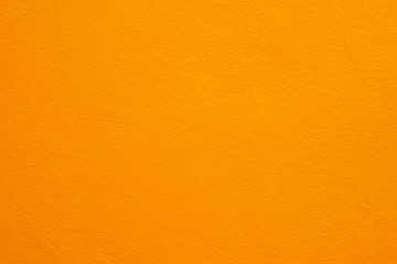Naklejka premium Orange wall texture background for copy space, backdrop, design, wallpaper and background.