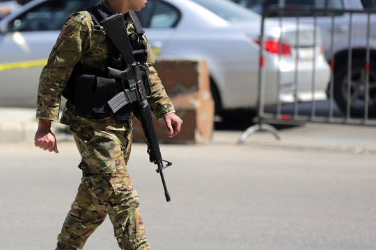 Lebanese soldier patrols Beirut street
