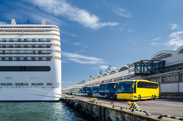A CRUISE SHIP AND BUSES - The seaport of sea port at passenger terminal in Gdynia