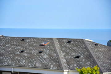 Asphalt roofing shingles,sky background © Bigy