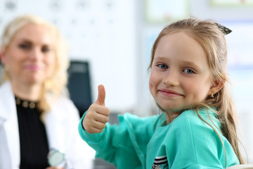 Cute little girl at doctor office showing respect and gratitude