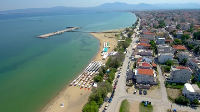 Aerial view of a stunning beach in a tourist village., Perea Thessaloniki Greece, move forward by drone