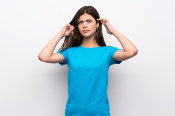 Fototapeta premium Teenager girl with blue shirt having doubts and thinking