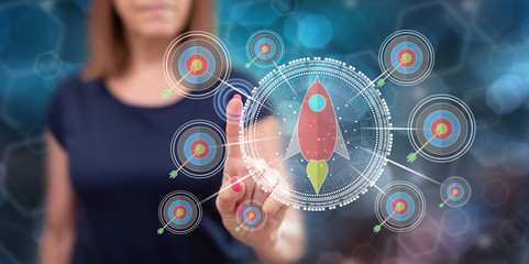 Woman touching a business target concept