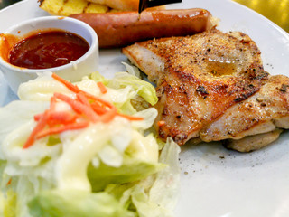 Grilled Pork Steak and German Sausage and Salad