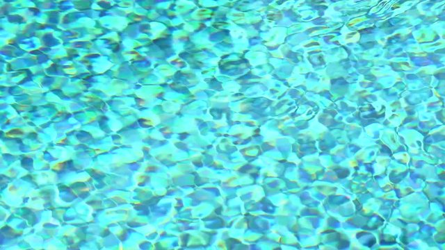 wave on water surface background in swimming pool blue tiles