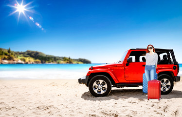 Summer time on beach and two young people with red summer car. 
