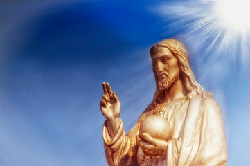 The statue of Jesus Christ. He holds the sphere with a cross as a symbol of the trusteeship of Christianity above the earth (faith concept)