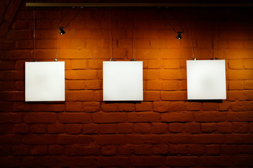 Blank white posters in glassy showcase on the street, mock up