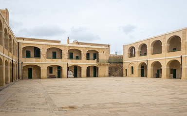 Fototapeta na wymiar Panoramic Intramural view on buildings of Fort St. Elmo. Valletta, Malta, Europe.
