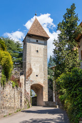 Fototapeta na wymiar Old Entrance Gate of Meran (ger. Passeirertor der Meraner Stadtmauer). Merano, Province Bolzano, South Tyrol, Italy.