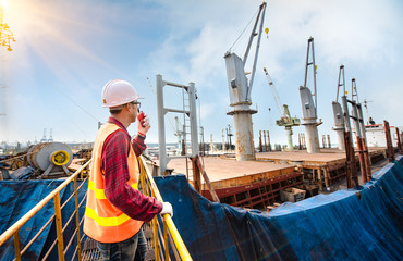foreman, supervisor, inspector, worker, engineering works on climb against safety system and...
