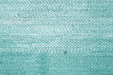 Fototapeta premium Pattern of brick wall with blur effect in cyan tone.