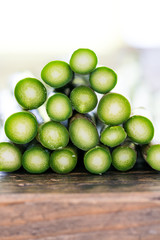 close up macro view of stacked fresh organic green asparagus