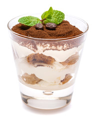 Classic tiramisu dessert in a glass isolated on a white background with clipping path
