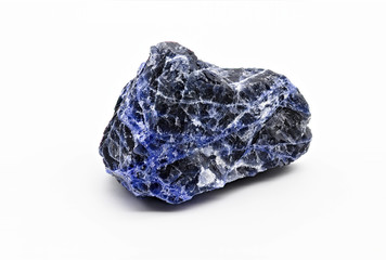 Black and blue veined sodalite mineral stone specimen isolated on white limbo background