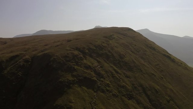 Drone waterfall pull back shot from Knott Rigg and Ard Crags in The Lake District, Cumbria