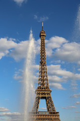 Eiffel Tower in Paris France with clouds on the sky