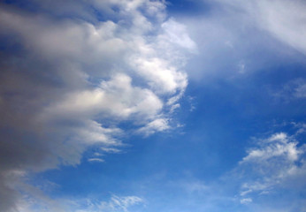Naklejka na ściany i meble background of blue sky with white clouds