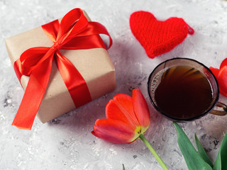 gift box in tulips and a Cup of coffee