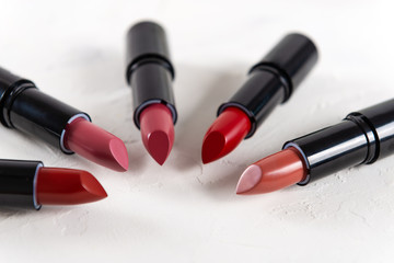 Different lipsticks on white background. Fashion. Professional Makeup and Beauty. Beautiful Make-up...