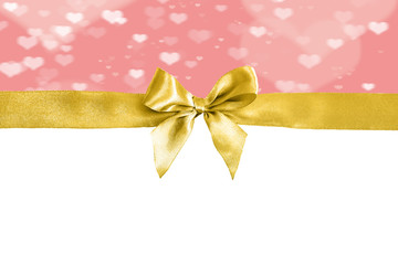 Golden ribbon with decorative bow on a white background. Festive background.
