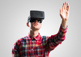 Guy in mask experiencing virtual reality as new entertainment device