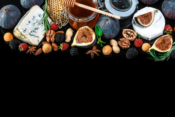 cheese platter, figs and honey, snacks, on old wooden table. top view. copy space
