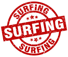 surfing round red grunge stamp