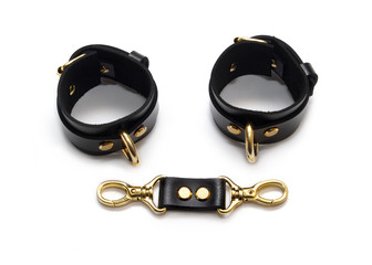 BDSM leather bracelets on the arm. Isolated on white background