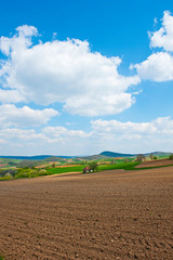 Field and green mountains view at sunny day