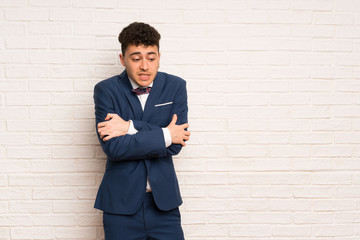 Man in suit and bow tie freezing