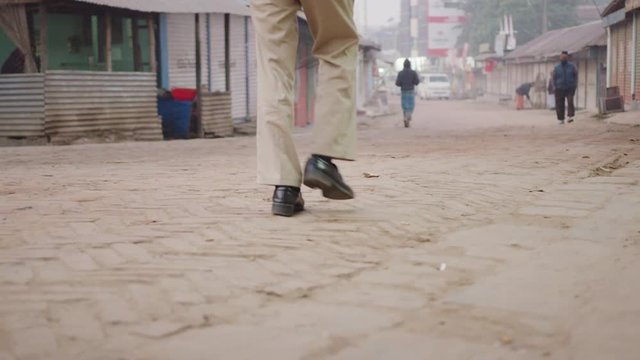 Man walking on the brick street in Bangladesh