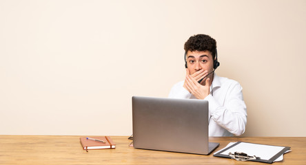 Telemarketer man covering mouth with hands