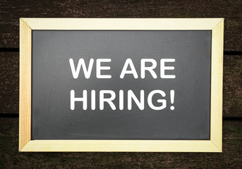 We are hiring, words printed on board