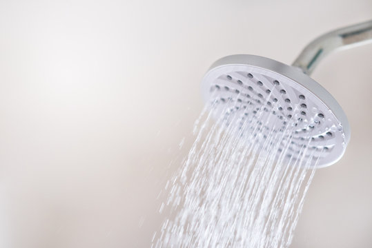 Close up of a Shower head with running water motion. concept of hygiene, healthcare and save water