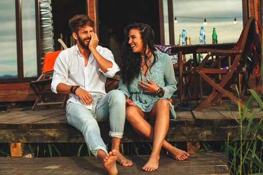 Young Couple Enjoying The Summer On The Porch