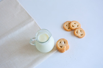 Milk and cookies on the white background