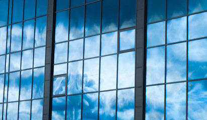 Windows of building reflexes the sky