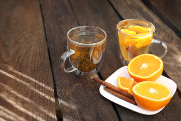 Green tea with orange, blooming green tea in a glass