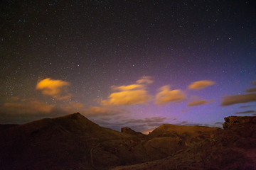 Beautiful landscape nightscape of a colorful starry night sky on the island Madeira at Ponta de Sao Lourenco nature reserve