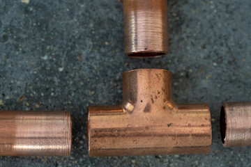 Copper fittings with a strand of sodder