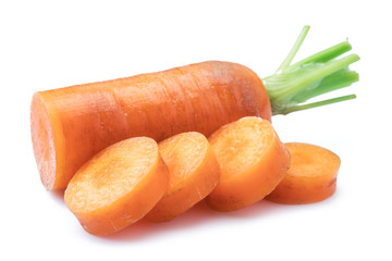 Fresh organic carrots and carrot slices on white background.