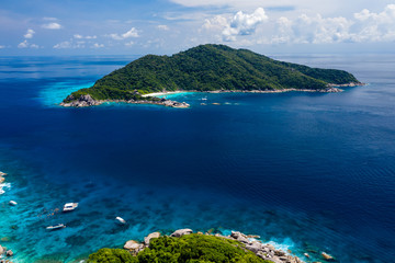 Obraz premium Aerial drone view of diving and snorkel boats around the beautiful tropical Similan Islands in Thailand