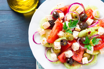 Greek salad with olive oil top view
