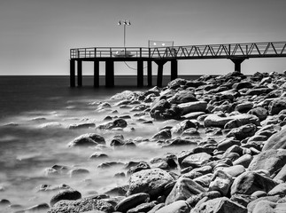 Beach pier in Xilxes, Spain. Photo with infrared filter
