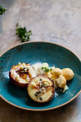 Baked peaches with ice cream and amaretti biscuit
