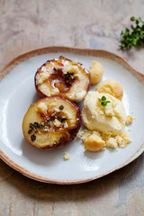 Baked peaches with ice cream and amaretti biscuit