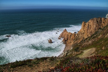 Brave sea and cliffs of the coast of Azenhas do Mar in Portugal
