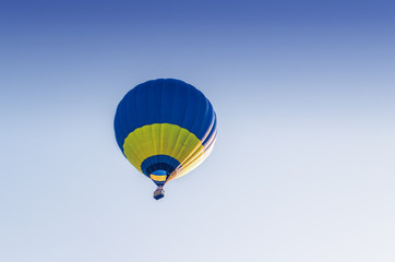 Colorful hot air balloon flying in the blue sky